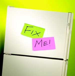 Broken Fridge with "Fix Me" Sticky Notes