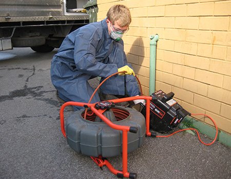 A technician begins the Placitas hydro-jetting procedure